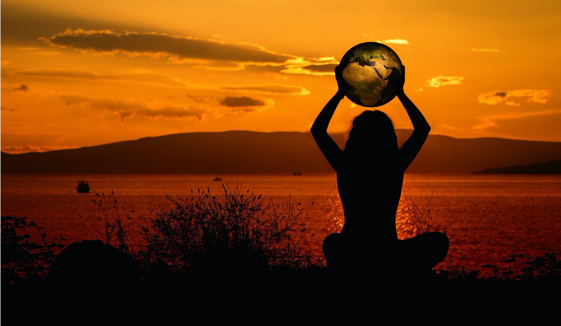 Sustainability Pledge image | One Wear Freedom | Sunset silhouette of woman holding the world or globe | saving mother earth
